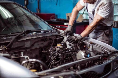 mechanic-maintaining-car-engine- mechanic-maintaining-car-engine-
