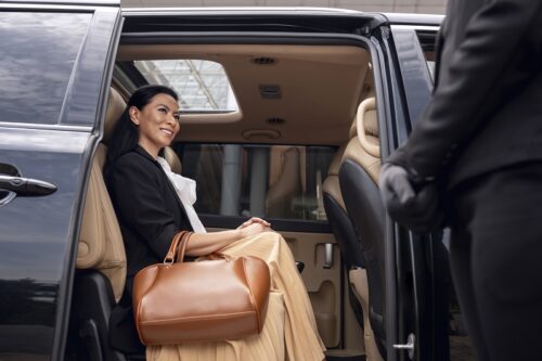 businesswoman-getting-taxi-cab (1) businesswoman-getting-taxi-cab (1)