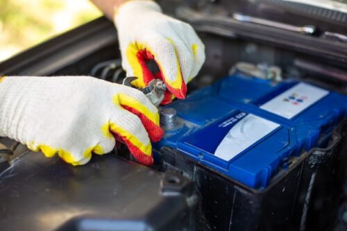 car-mechanic-unscrews-bolts-car-battery-accumulator-installation-replacement-repair_326821-963 car-mechanic-unscrews-bolts-car-battery-accumulator-installation-replacement-repair_326821-963