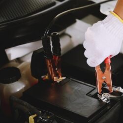 mechanic-is-charging-car-battery-pot_1016700-591
