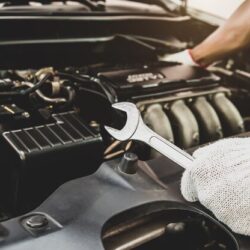 close-up-hands-auto-mechanic-using-wrench-maintenance-car-engine_101448-2193