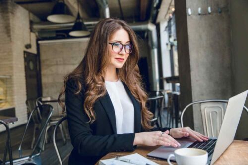 smiling-businesswoman-typing-laptop-sitting-cafe (1) smiling-businesswoman-typing-laptop-sitting-cafe (1)