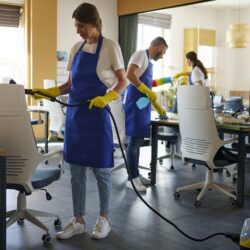 professional-cleaning-service-person-using-vacuum-cleaner-office