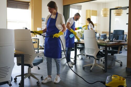 professional-cleaning-service-person-using-vacuum-cleaner-office professional-cleaning-service-person-using-vacuum-cleaner-office