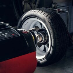 parts-of-broken-red-car-in-workshop (1)