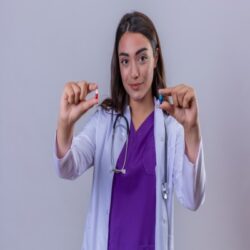 young-woman-doctor-white-coat-with-phonendoscope-looking-camera-with-smile-face-holding-small-pills-hands-white-isolated-background (3)