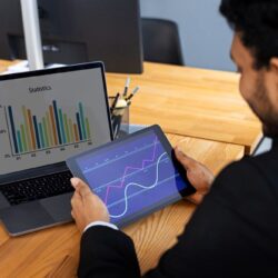 business-person-looking-finance-graphs (1)