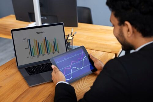 business-person-looking-finance-graphs (1) business-person-looking-finance-graphs (1)