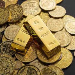 coins-gold-bars-scattered-table (1)